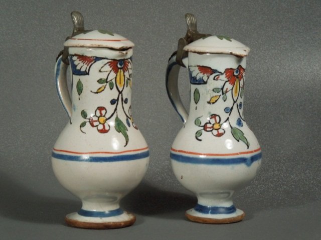 Pr of 18th century Delft Polychrome Majolica Ewers: Fabulous pair of either 18th century Italian majolica or Faience Ewers. Fine polychrome painting and form. Measures 4 1/2 " tall