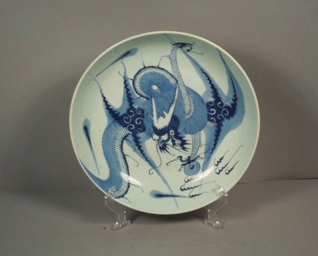 Chinese 17th c. Dragon Blue and White Lg. Bowl: Chinese blue and white possibly Ming Dynasty large Charger bowl. This has a superb painted dragon with an unglazed back. Measures 10 5/8 ".