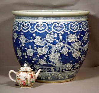 Chinese 18/19th c. Large Kangxi Prunus Jardiniere: Chinese very large blue and white Kangxi pattern 18/19th century jardiniere Decorated all over with white prunus branches reserved on a blue cracked-ice-pattern ground. Measures 18 1/2 " diameter by 1