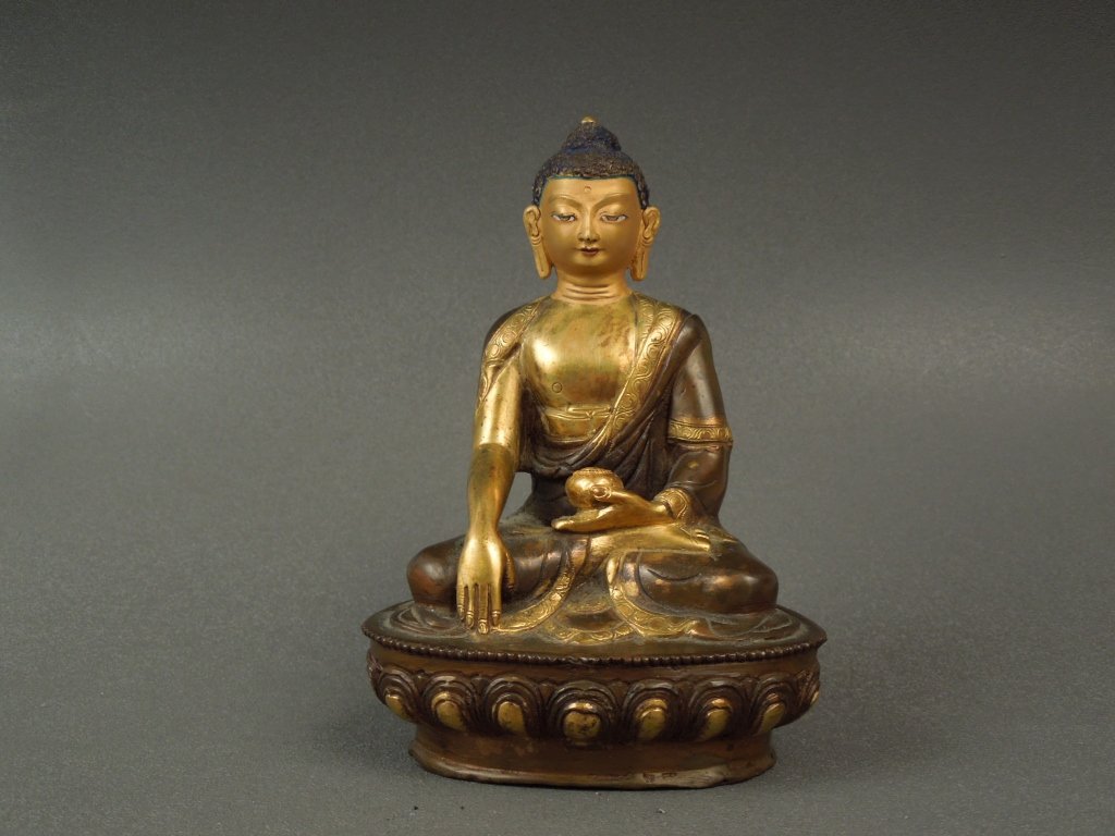Tibetan or Nepalese Bronze Buddha: Tibetan or Nepalese seated bronze figure of Buddha with blue pigment to hair; measures 6".