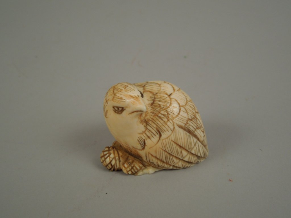 Fine Quality Carved Quail Ivory Netsuke: Vintage finely carved quail ivory netsuke; measures 1 1/2" long; International shipping is not available for this item. This item will only be shipped within the United States.