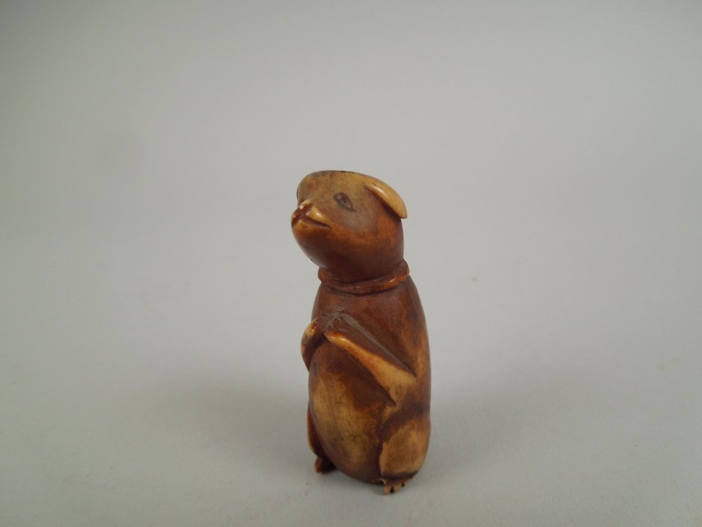 Very Early Netsuke in the Form of a Dog: Very early antique netsuke in the form of a dog; measures 1 1/2".
