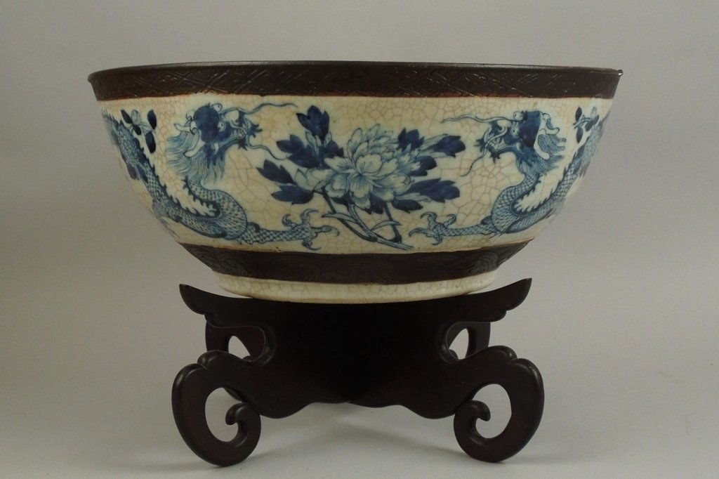 Antique Chinese Dragon Crackle Glazed Punch Bowl: Antique Chinese large, almost 15" in diameter, crackle glazed dragon punch bowl; the sides are finely painted with under glaze blue dragons and the inner border has the cracked ice prunus pattern; the