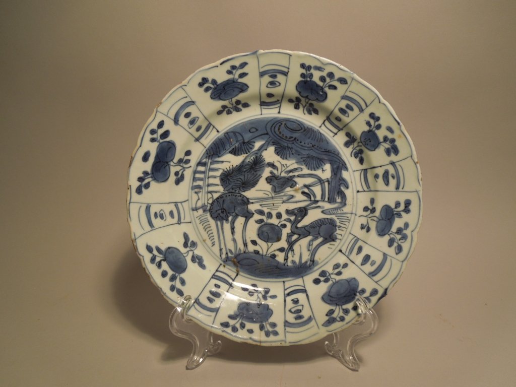 Chinese Wan Li Period B/W Kraak Deer Plate: Ming Dynasty, Wan Li period circa 1600-20, blue and white Kraak porcelain plate; painted with central roundels of deer amongst pine and rockwork within border panels of stylized flower sprays ; measur