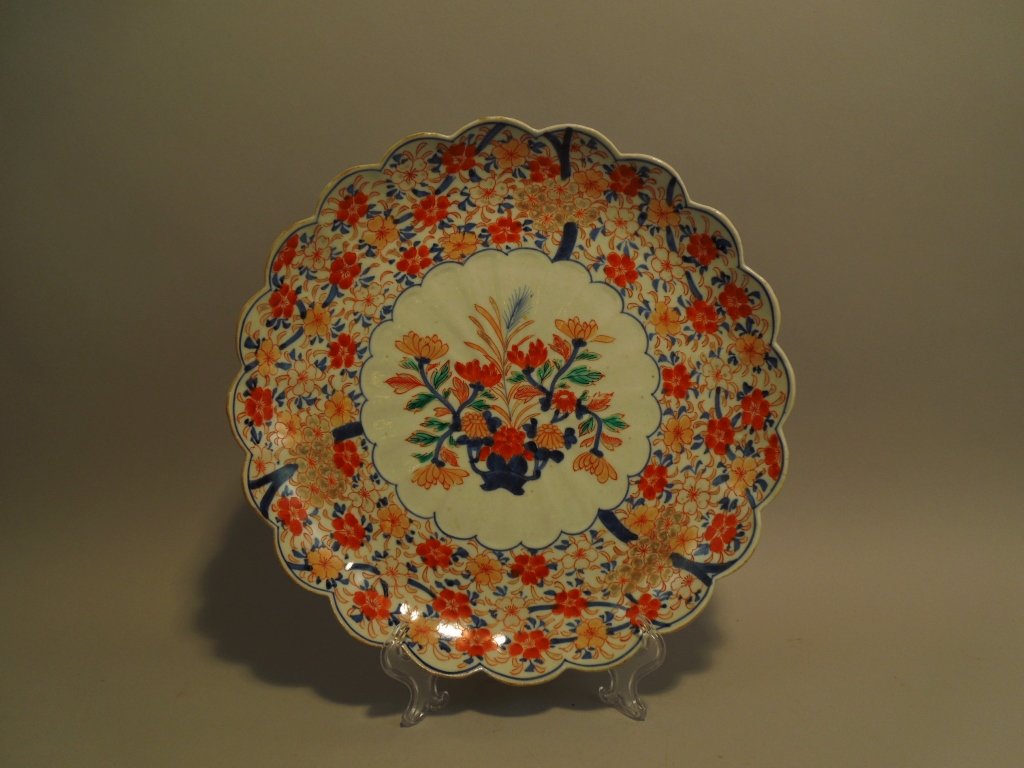 Japanese 19th Century Imari Charger: Antique 19th century Japanese Imari charger; very nice iron red and blue underglaze painting along with gold accents; measures 12".