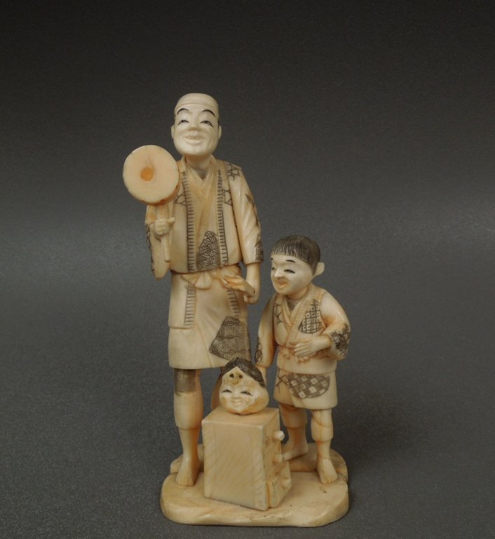 Fine Japanese Antique Ivory Carved Figure: Fine Japanese antique Ivory carved figure of a man and boy; measures 6 3/4"; International shipping is not available for this item. This item will only be shipped within the United States.