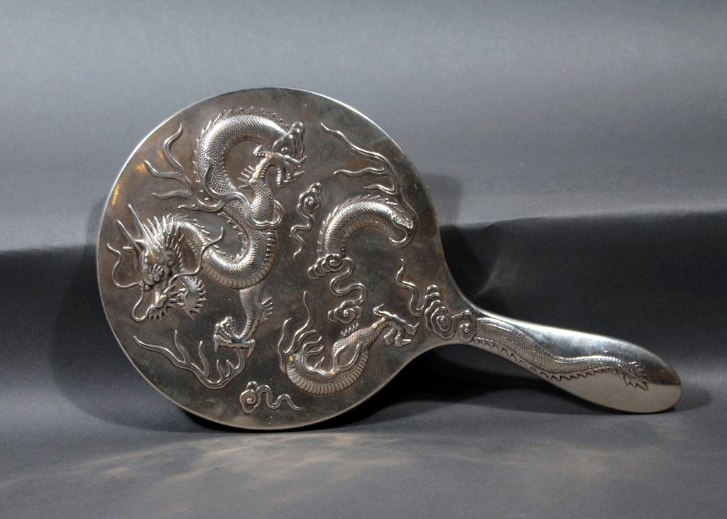 Fine Quality Chinese Marked Silver Dragon Mirror: Antique fine quality Chinese marked Sterling Silver large dragon mirror with engraved Wang Hing and company late 1800's; measures 10 1/2" long by 6" in diameter very heavy silver and great detail. Ver