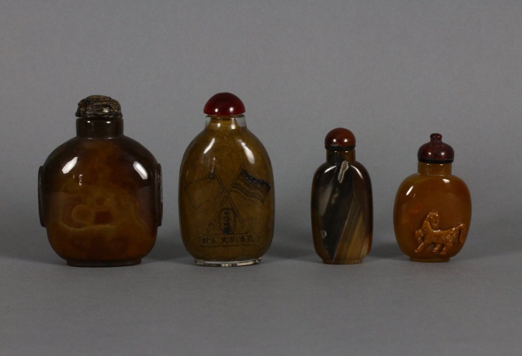 Group Of 4 Chinese Agate Snuff Bottles: Four Chinese Agate Snuff Bottles; one with carving of a horse; largest bottle measures 7.5 cm / 3 inches tall.