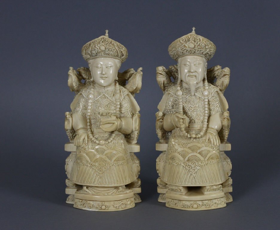 Pair Chinese Carved Ivory Emperor And Empress: Antique Chinese Carved African Ivory Emperor And Empress; late 19th/early 20th century; measures 18 cm / 7 inches tall. weight 728 and 711 grams.