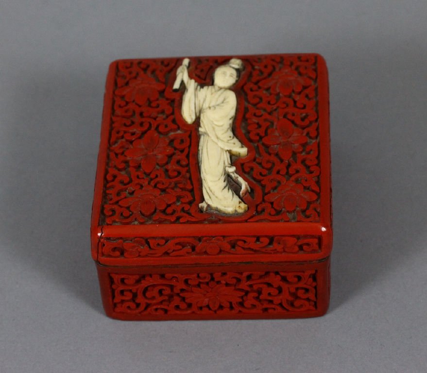 Chinese Cinnabar box with Ivory figure: Chinese cinnabar box with Ivory figure; measures 9 cm / 3.5 inches in diameter.