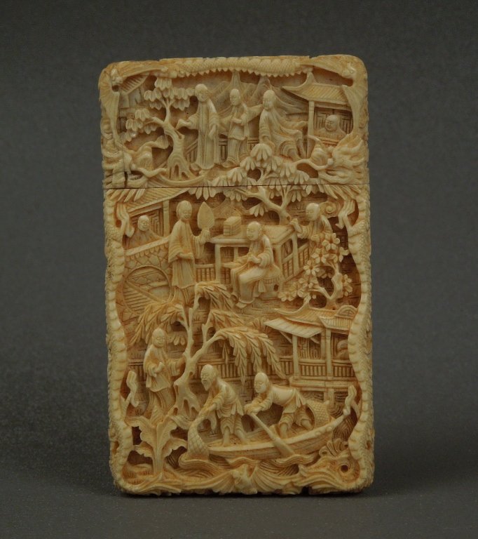 Chinese Ivory 19th c. Canton Carved Card Case: Fine quality Chinese ivory 19th century Canton carved card case with intricate, with three-dimensional superb carving throughout.; dating from the 1800s; measures 3 7/8" x 2 1/2".---------------------