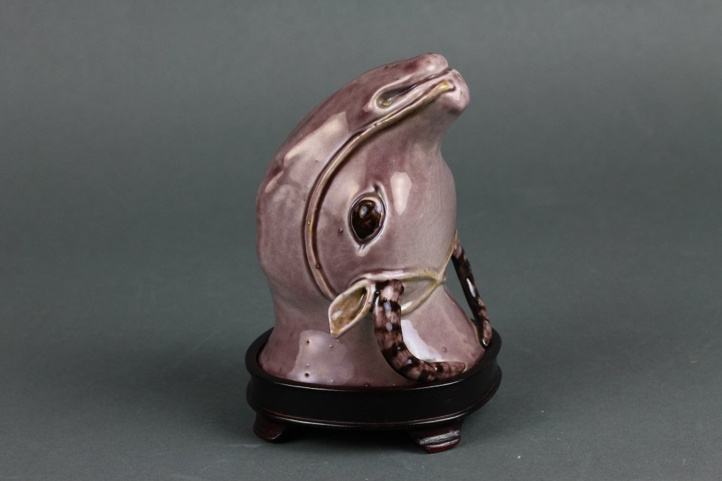Chinese 18thc. Aubergine Water Buffalo Stirrup Cup: Rare Chinese 18th century aubergine water buffalo porcelain stirrup cup on wood stand with a fabulous aubergine outside glaze along with a turquoise inside glaze; good condition; measures (11.5cm) 4.5