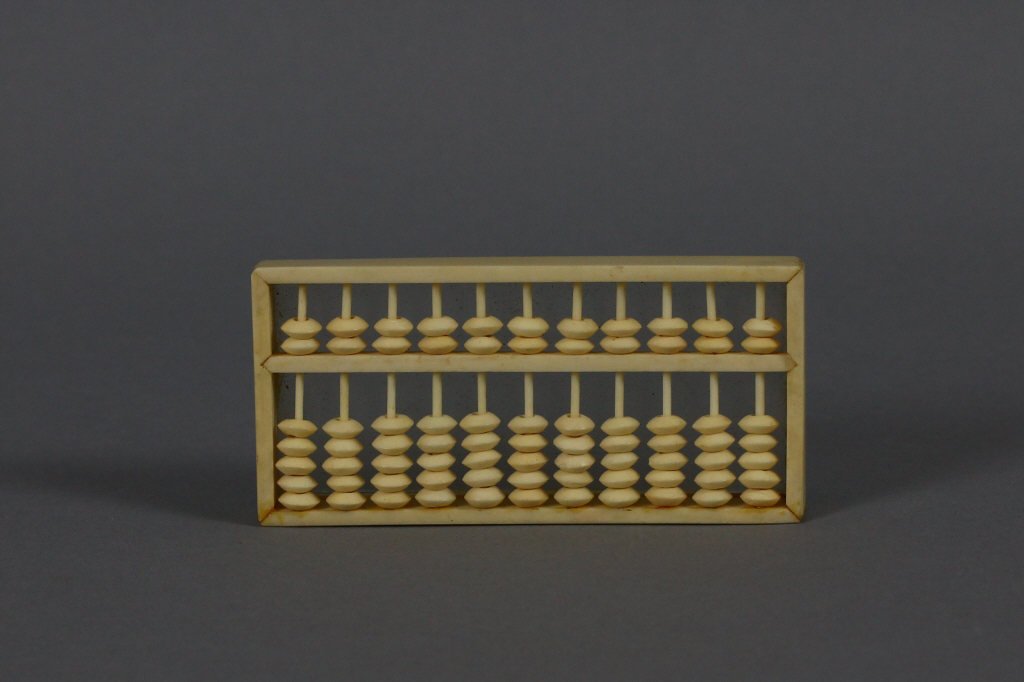 Antique Chinese Ivory Abacus 19th/20th Century: Hand-carved Antique Ivory Abacus measures (9 cm) 3.5'' long.