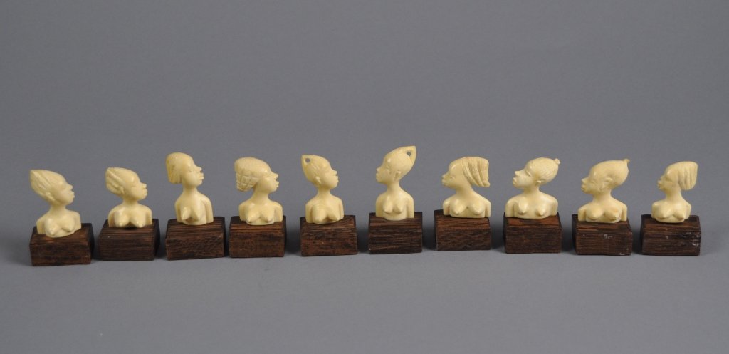 Set of Ten African Ivory Card Dinner Place Holders: Lot of ten Ivory place card holders in the form of busts of African women. These ivories were a gift to Ambassador Ragnar Petri during his tenure as diplomat to the Congo in the early 1970s; measures