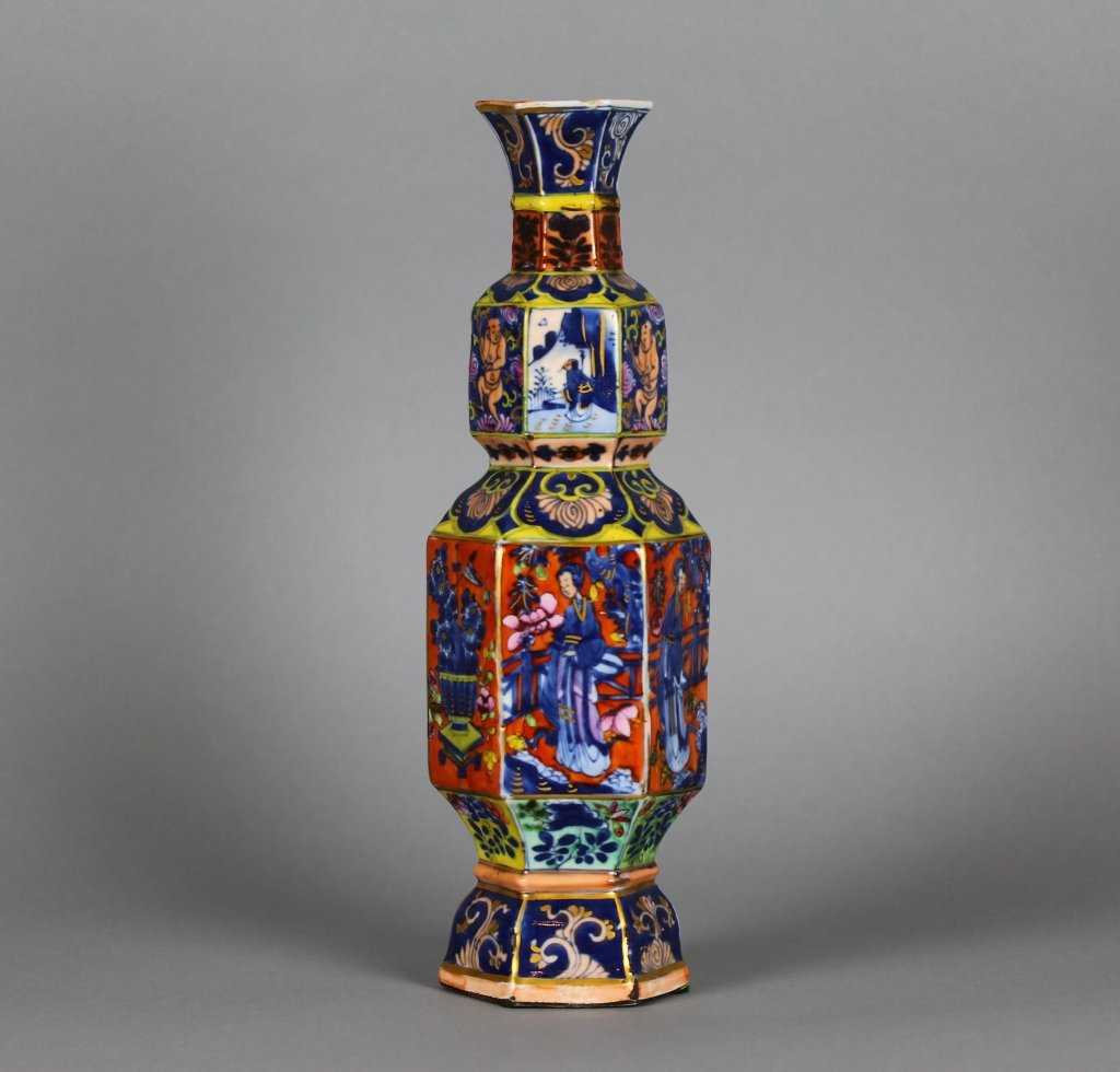 Chinese Kangxi 1662-1722 Clobbered Blue/White Vase: CHINESE CLOBBERED BLUE AND WHITE HEXAGONAL VASE KANGXI PERIOD (1662-1722) Painted in underglaze blue and later bold enamels and gilt with panels of ladies children and blossoming sprays issuing from j