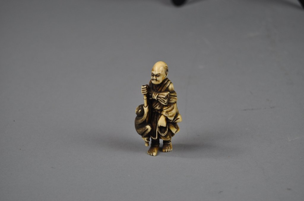 Antique Japanese Carved Ivory Netsuke Figure: Antique Japanese 19th century Carved Ivory Netsuke Figure; measures (7cm) 2.75" h. / This collection, having belonged to Mrs. Dufeu's father Gylfe Burdin, has not been seen on the market in many decad