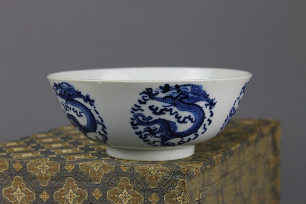 Chinese Blue and White Qing Dynasty Bowl: Chinese Blue and White Qing Dynasty Dragon marked Bowl; one tiny frit to rim; measures 6.25" d.