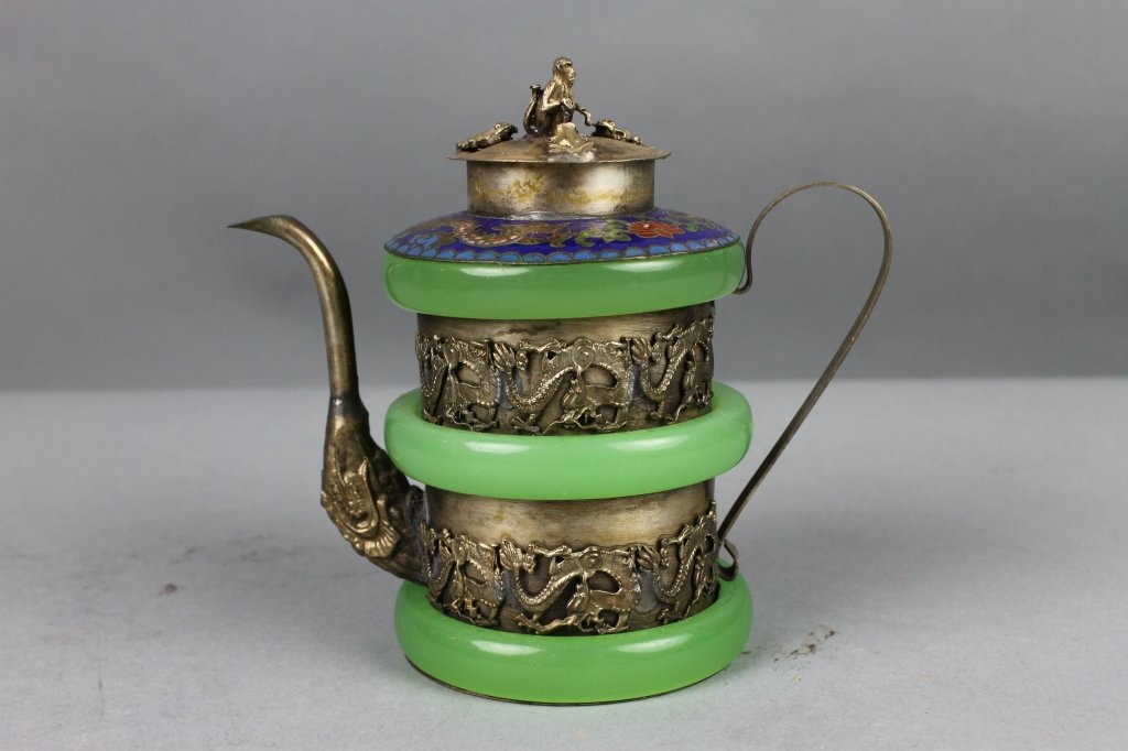 Chinese Jade and Silver Teapot with Chinese Mark.: Chinese Jade and Silver Teapot with Chinese Mark. A trio of jade bangles banding around dragon decor ,the enameled top depicting dragons amidst waves and shells. A monkey and trio of frogs sit on the 
