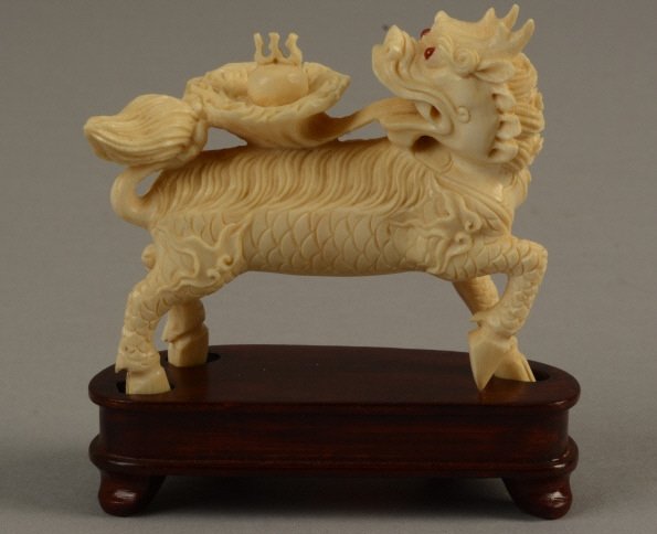 Antique Chinese Ivory Foo Dog: Antique ivory foo dog playing with puppy; measures 3" (7.5 cm).