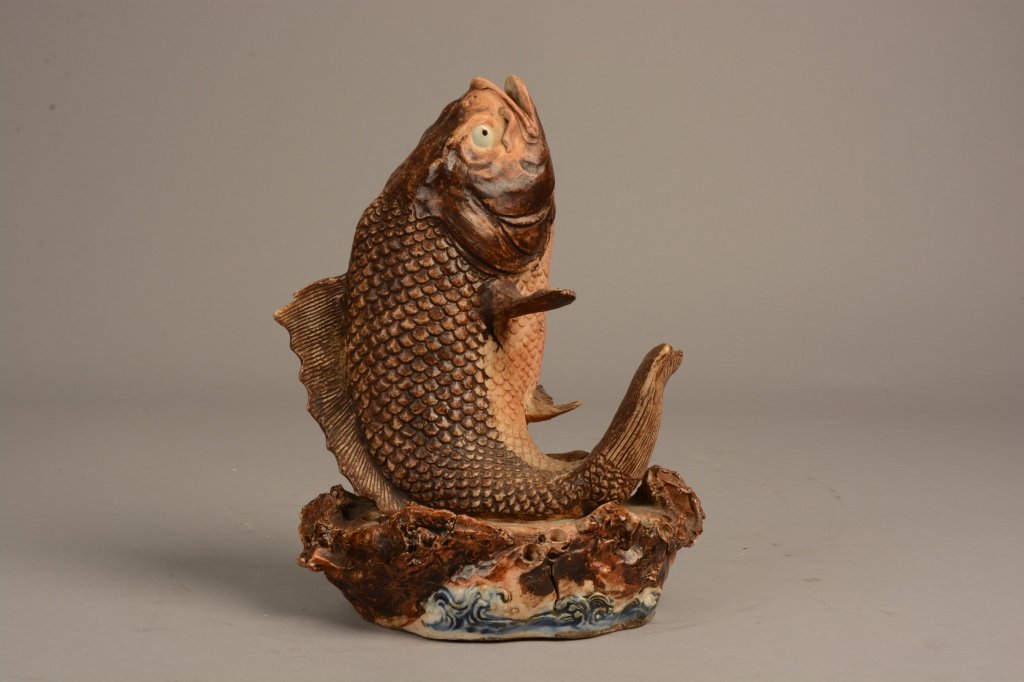 Japanese Meiji Period Koi Fish Vase: Japanese Meiji period decorated porcelain vase formed as a Koi fish upon a wonderful base suggesting coral and ocean; measures 10.5 " (27 cm) high.