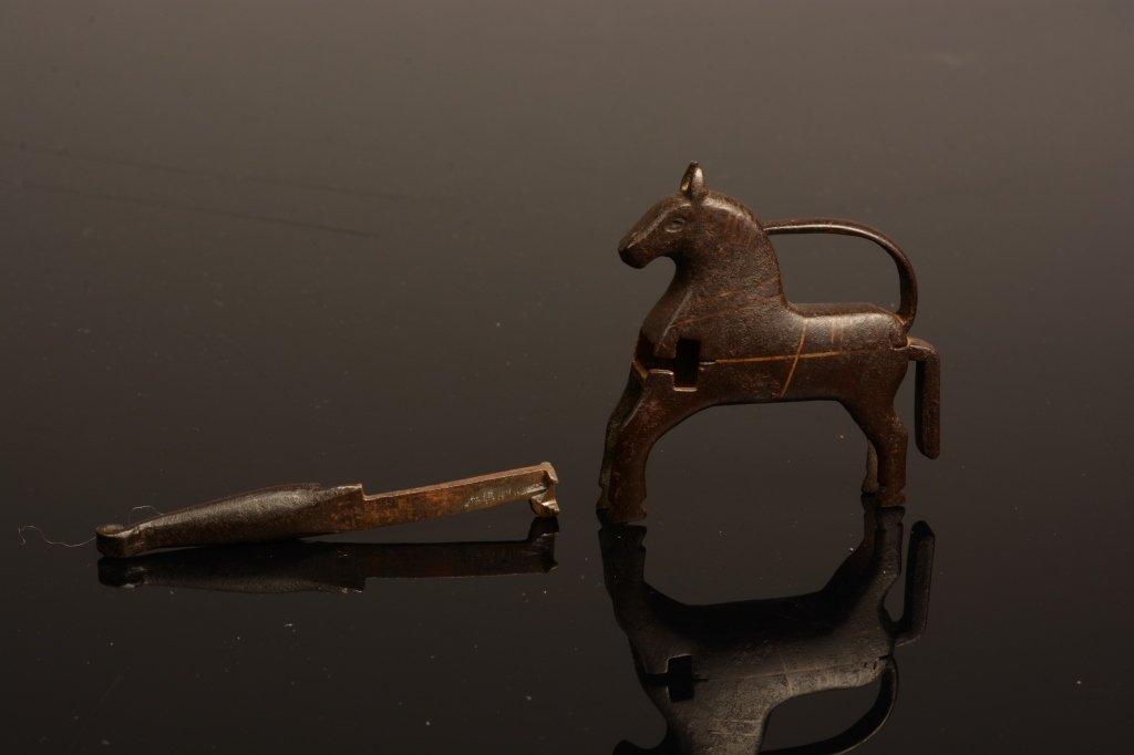 Ming Dynasty Chinese Figural Horse Lock: Ming Dynasty Chinese figural horse lock made of iron with brass or bronze inlay. With key, functional lock. Measures 2 3/8" tall.