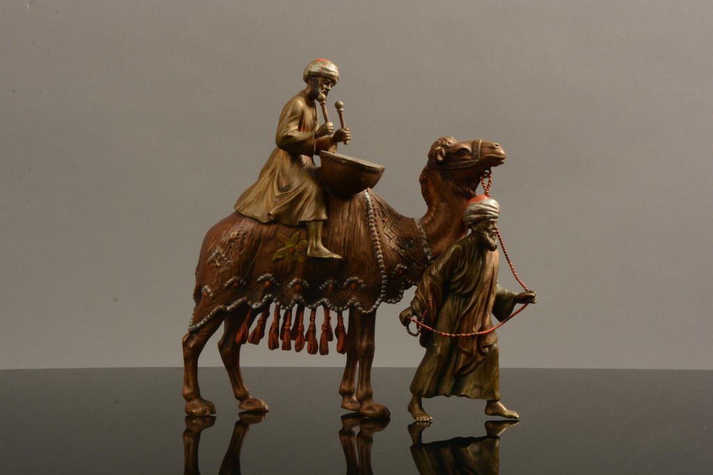 Austrian Cold Painted Bronze Arab Camel Bergman: Excellent quality Austrian cold painted bronze camel with Bedouin drum playing rider and guide by Franz Bergman; 7" tall.