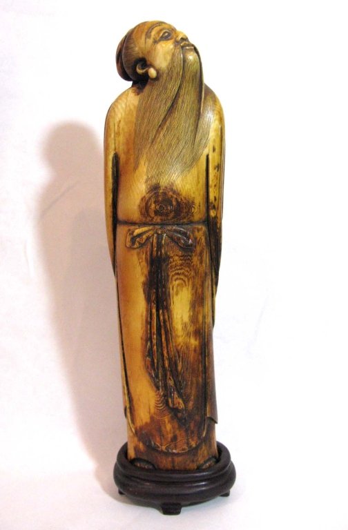 Chinese Large Antique Immortal Carved Ivory Figure: Chinese tea stained large Antique Immortal Carved Ivory Figure possibly from the Ming Dynasty; good condition; measures 11" (28cm)