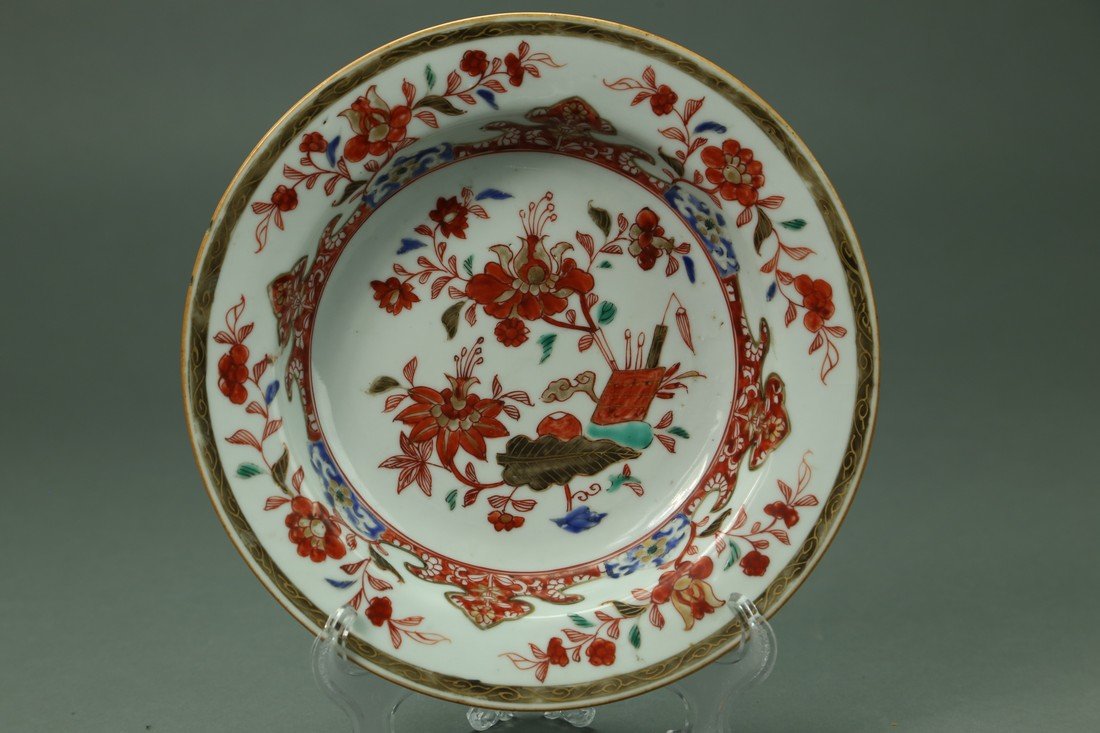 Chinese Imari Kangxi Period (1662-1722) Bowl Yongzheng: Yongzheng Period (1722-1735) Chinese Imari deep bowl in the imari pattern; measures (23cm) 9" d; (5cm) 2" h.; condition minor frits to rim consistent with age. Has old collectors label on back.