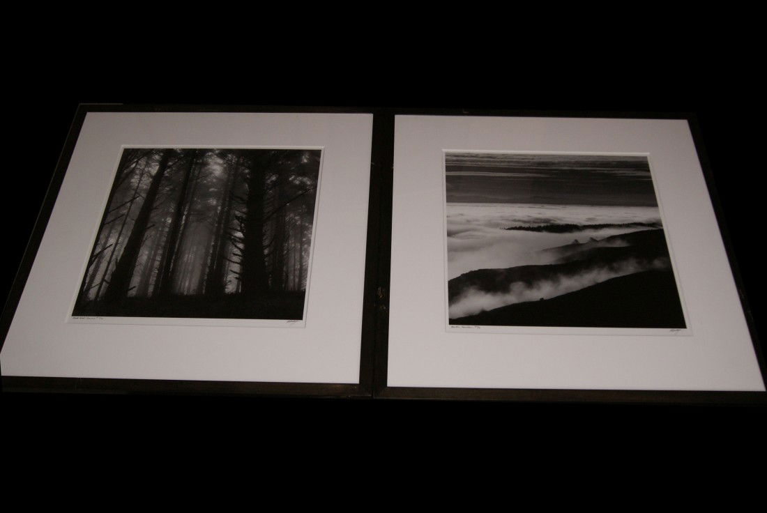 Pair of Robert Buelteman Photographs, signed: Gelatin silver prints "Black Forest Sunrise" 1991 #3/40 and "Montara Mountain" 1991 #4/40, both signed at lower right. Framed, slight damage to black frames. Both measure approx: 31" tall x 31" wide o