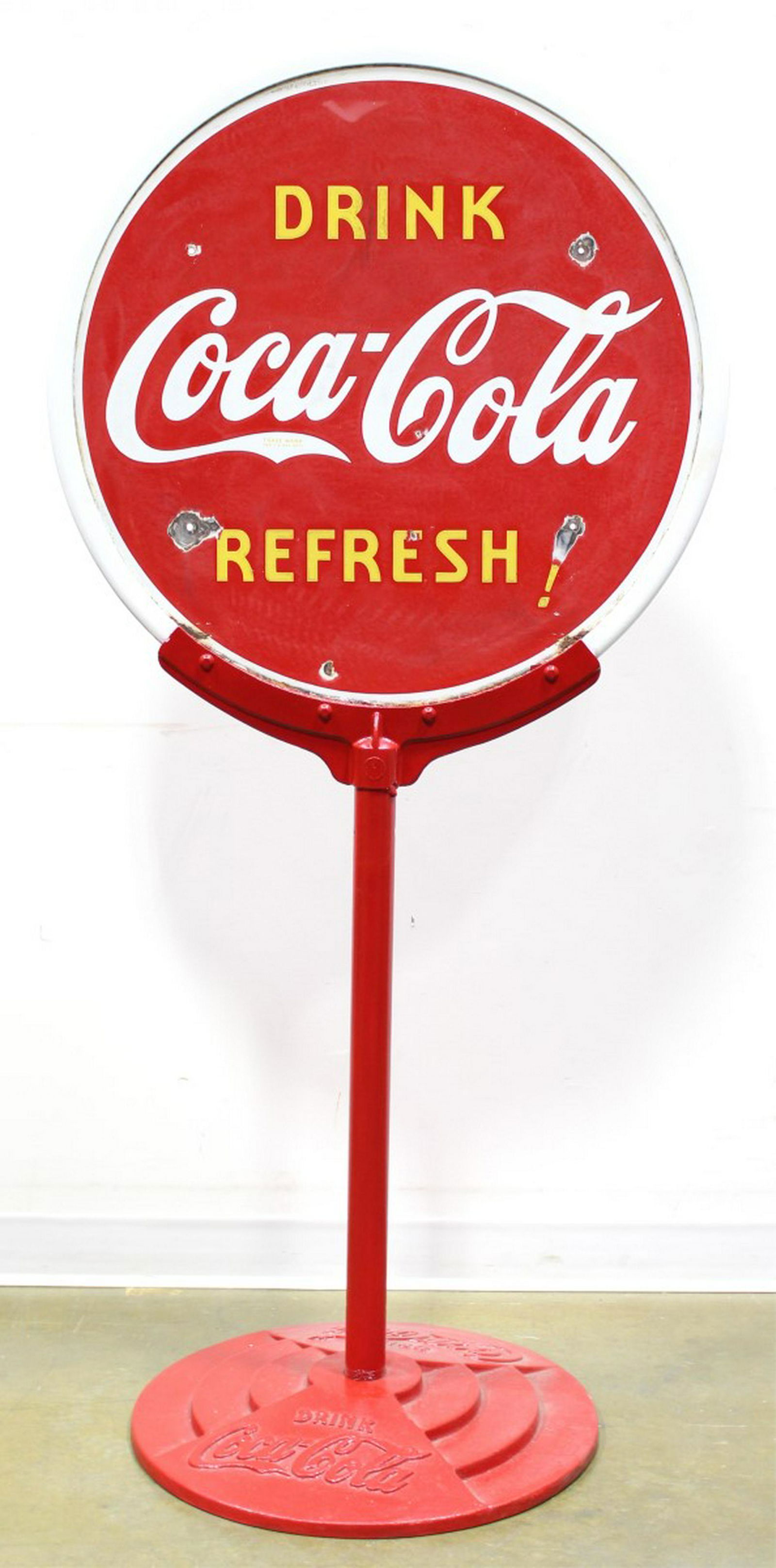 COCA-COLA LOLLIPOP SIGN: COCA-COLA LOLLIPOP SIGN -porcelain "Drink Coca-Cola Refresh" double sided sign with red cast iron frame and cast iron stand with relief embossed logo. Height: 65 in.