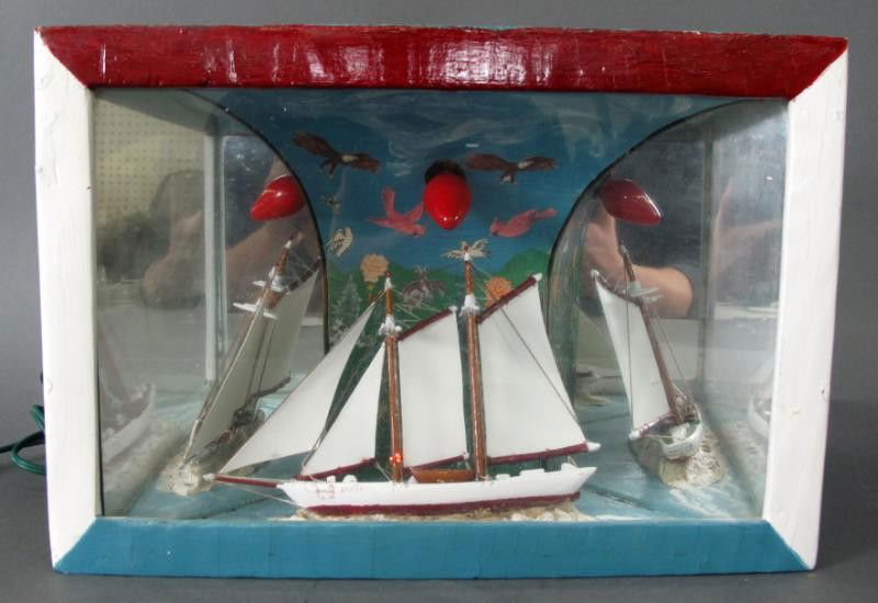 FOLK ART DIORAMA: - illuminating, mirror-backed diorama features sailboat at sea. Bost reads Bimbo, St. John. 9 in. x 13 1/4 in. x 6 in.