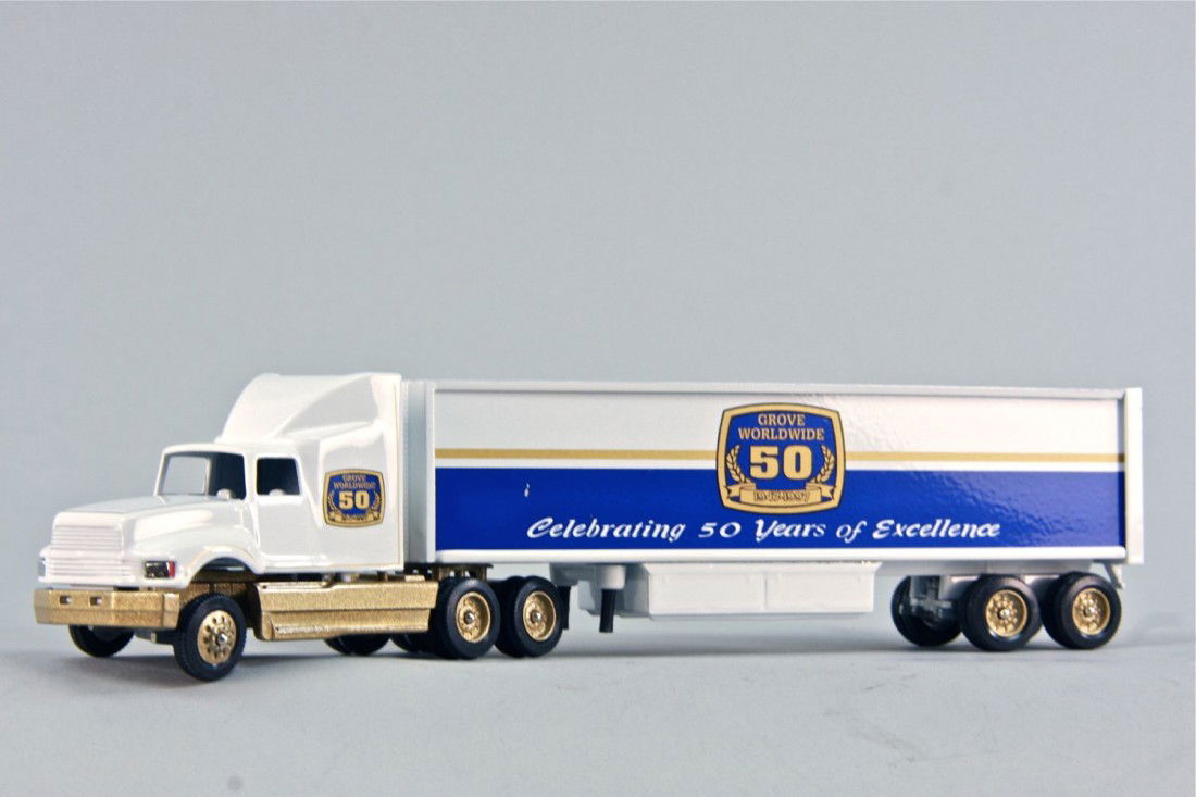 Ford LTLS9000 w/Box Trailer: Ford LTLS9000 w/Box Trailer made by Winross in the scale of 1:64. Manufacturer's Part Number is G0505. Model Condition is Mint. Box Condition is Mint. Grove Crane Anniversary Model.