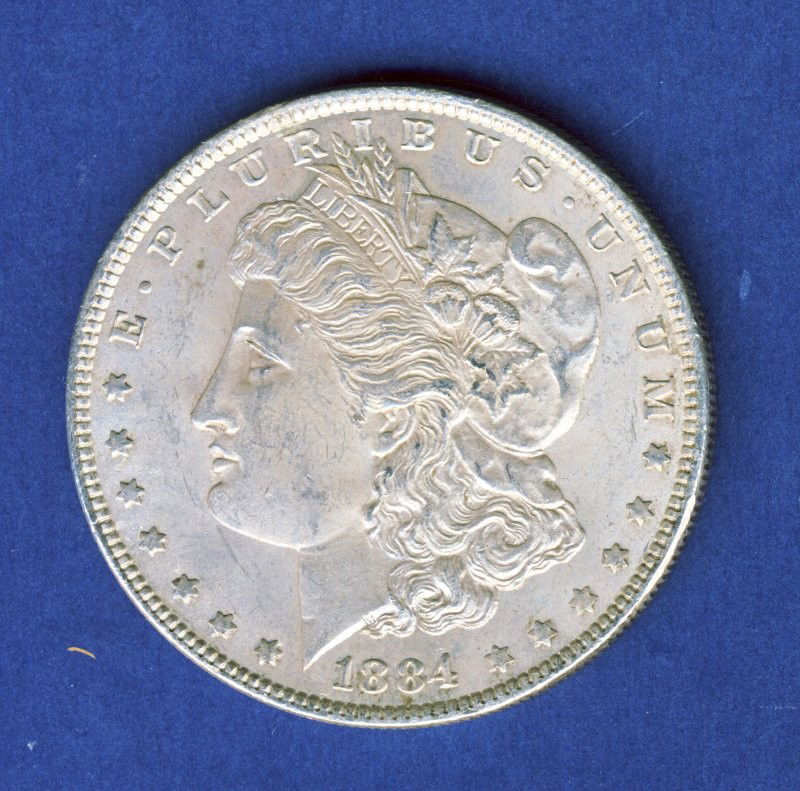 1884-P CHOICE BU MORGAN SILVER DOLLAR: A gorgeous high-end example with a whisper of lustrous original patina. 1884-P CHOICE BU MORGAN SILVER DOLLAR PB (KVMM PB)