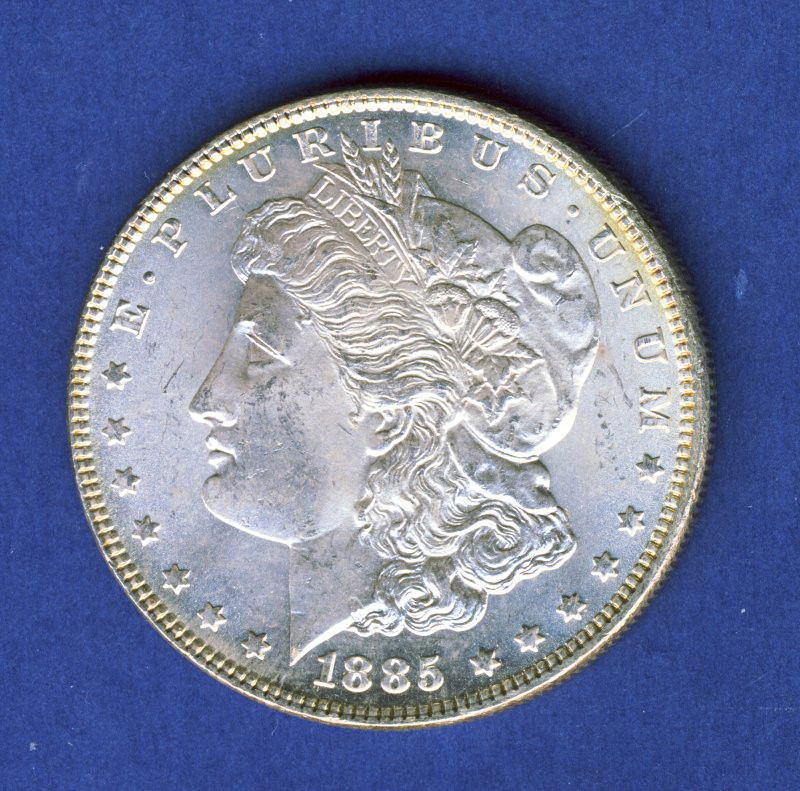 1885-P CHOICE BU MORGAN SILVER DOLLAR: A gorgeous high-end example with a whisper of lustrous original patina. 1885-P CHOICE BU MORGAN SILVER DOLLAR PB (KVMM PB)