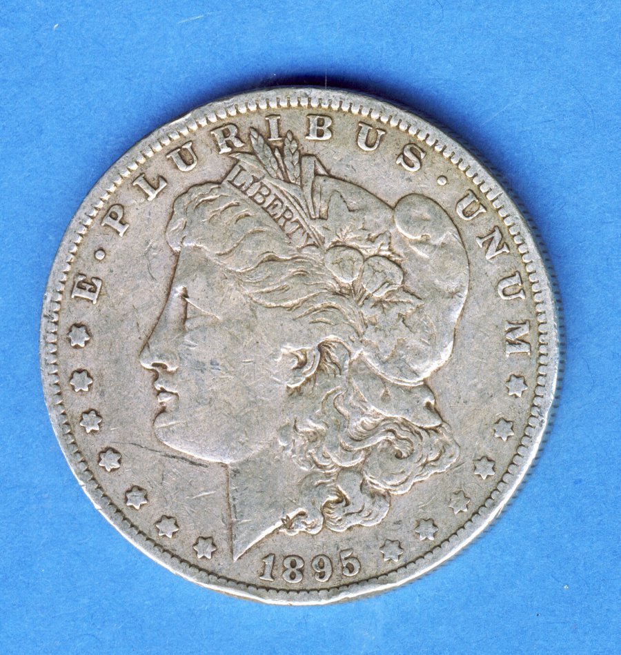 1895-O MORGAN SILVER DOLLAR VERY FINE VF: We are proud to tell you that in over 50,000 transactions spanning more than a decade, we have 100% customer satisfaction. But why? The answer is simple: we almost always answer our toll free number! 