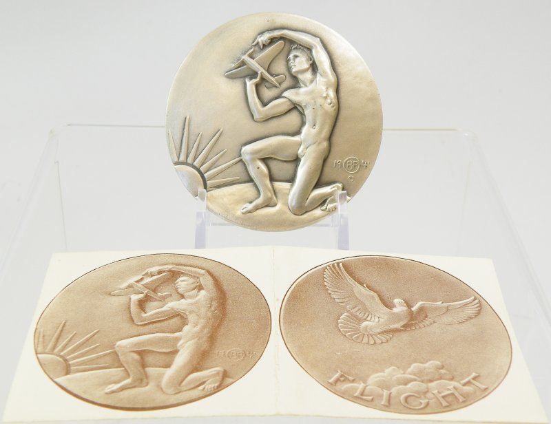 Medals #26 1942 Brenda Putman - Flight (Plane, Bird): Established in 1930 to promote medallic arts, The Society of Medalists immediately commissioned a series of medals to be fashioned by prominent sculptors. The series provided collectors two annual ent
