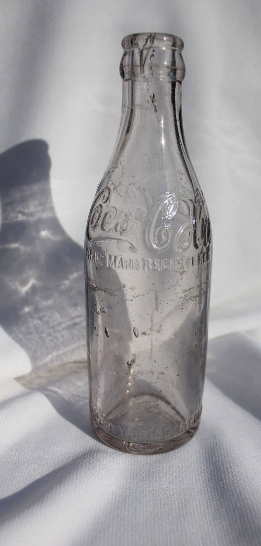 COCA-COLA STRAIGHT SIDE STYLE BOTTLE CA 1910: This bottle is clean and without cracks or dings. It is marked Birmingham ALA along the bottom., has a large number of bubbles and inclusions from its original manufacture.