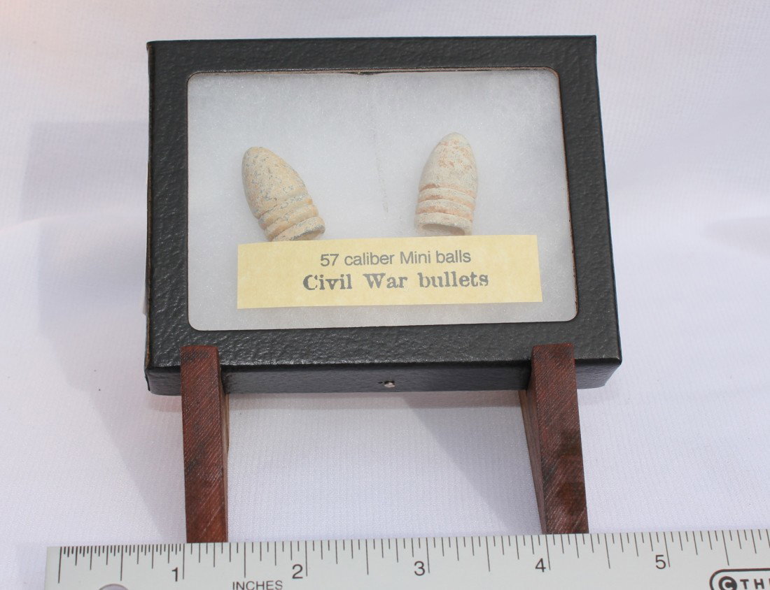 CIVIL WAR 57 CALIBER MINI BALLS: Two 57 caliber mini ball bullets in excavated condition. Found in Savannah Georgia. Shipping on this item is $5.50.