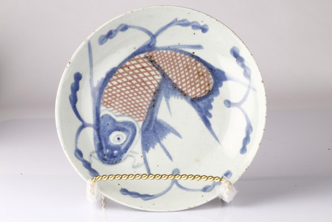 A underglaze-blue and copper-red charger, Late Qing (1 of 2)