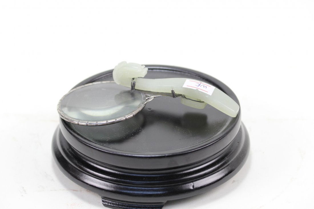 Sinkiang chinese white jade carved dragon: Sinkiang chinese white jade carved dragon with silver magnifying glass.With “made in china no:23 silver” mark.L:12.5cm