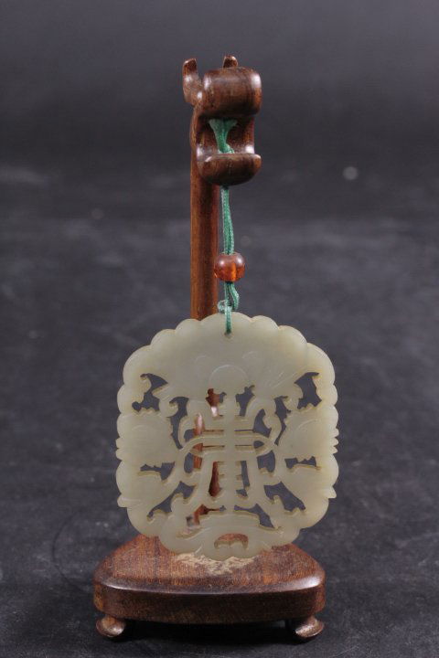OLD WHITE JADE CARVING PENDANT WITH WOODEN FRAME: Old white jade carving pendant with wooden frame. H: 13cm. Size of Jade: 5.5x5cm.