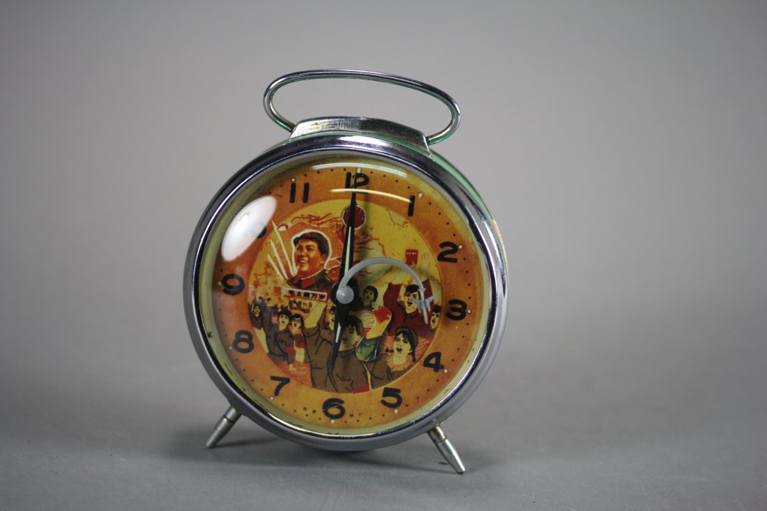 AN ALARM CLOCK AND A WATCH.: The Revolution period, painted with image of Mao, Zedong on dial plates. Condition: Good, both of them are working well.