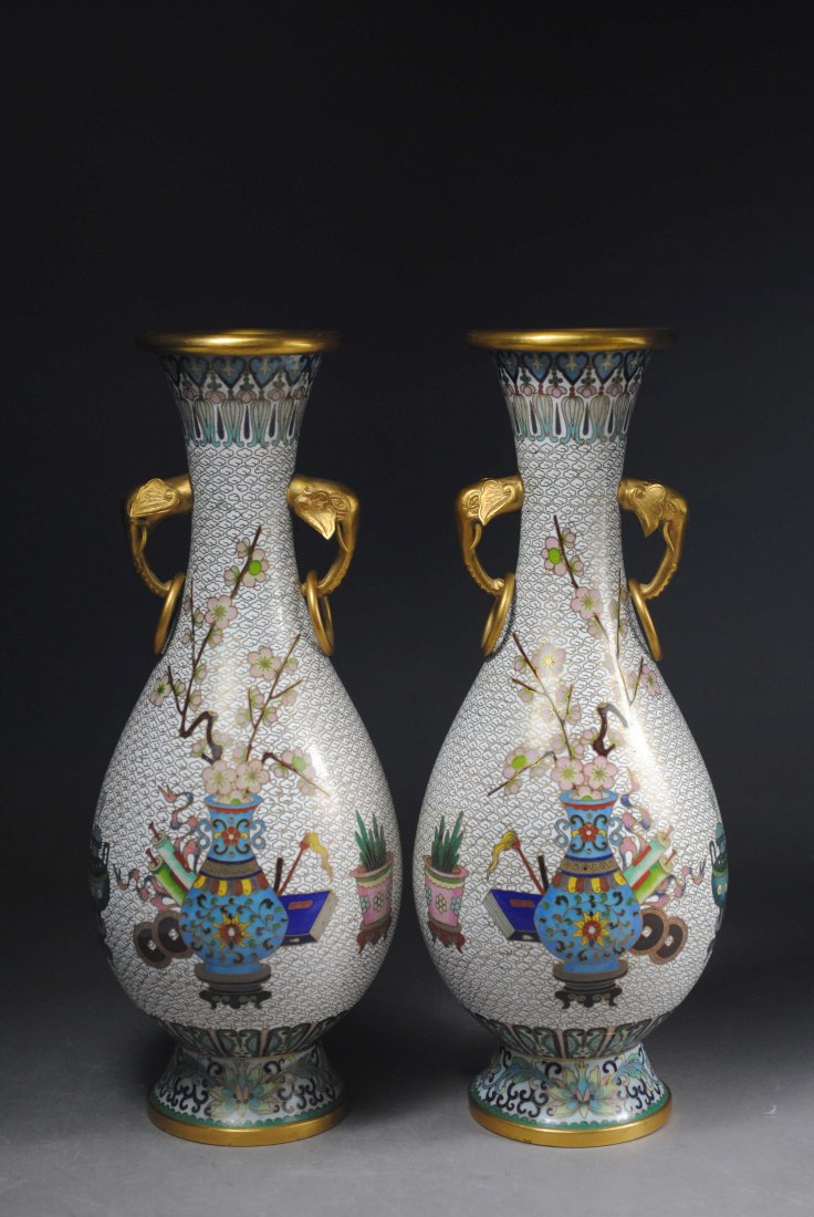 RARE REFINED EARS & RINGS CLOISONNE VASE.: The Republic of China period. Very finely painted with ancient antique grain on white. Rare elephantâ€™s head shape ears, with mobile rings. H: 31cm.