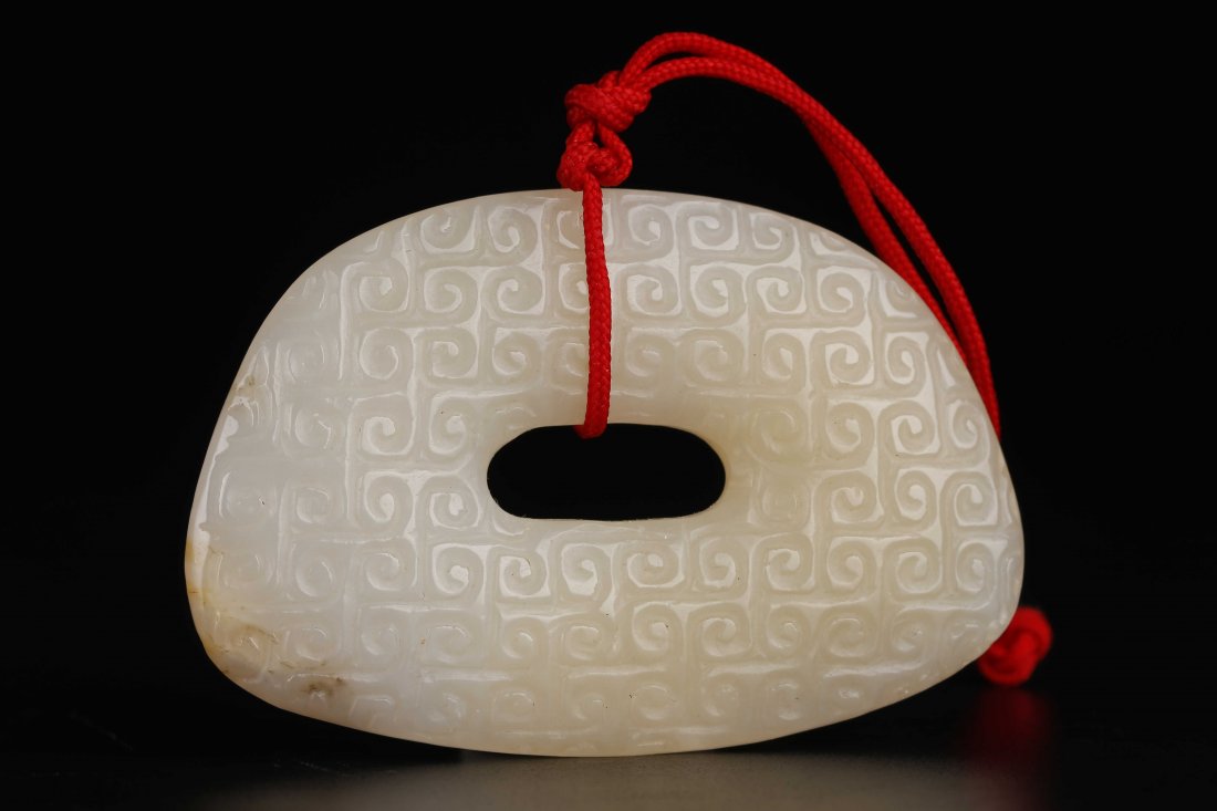 A Carved White Jade Pendant. (1 of 9)