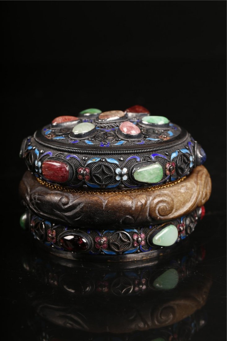 Filigree Enameled Silver Box.: A beautiful filigree silver box designed with floral patterns and inlayed with many different semi-precious stones such as jade, agate, and quartz. Late Qing/ Republican Peiod. Marked: Silver. Dia: 9.