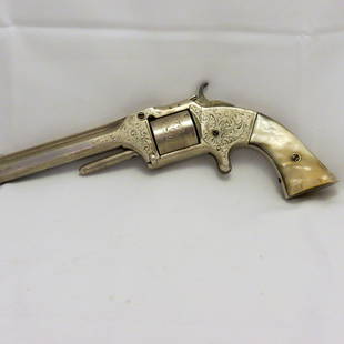 Collector Firearms: Factory Engraved Smith and Wesson Revolver, Serial No. 37118. Inscribed back strap, this belonged to a Mexican General. Pearl grips, name is partly missing and hard to read. Name engraved at factory