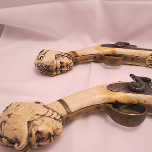 Collector Firearms: Matched Pair of Percussion Pistols. Not sure if made of Ivory or could be another material. Will sell as a set. These unique guns are begging for a case to set them off. Action on one pistol is loose,