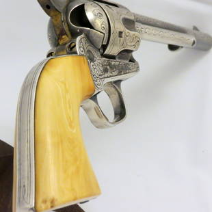 Collector Firearms: New York engraved Colt SAA made in 1882, Serial No.74400. Ivory handles appears to be silver finished with traces of a gold finish hammer. Very handsome revolver and in very good condition. Pre 1898 f