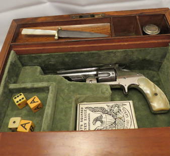 Collector Firearms: Gamblers & Writing Box with Smith & Wesson, Baby Russian( we believe),Model 1871, Serial No 17187. Pearl grips, lots of original nickel plate. Pearl handle knife, ink, pen, bottle ,ivory gambling dice