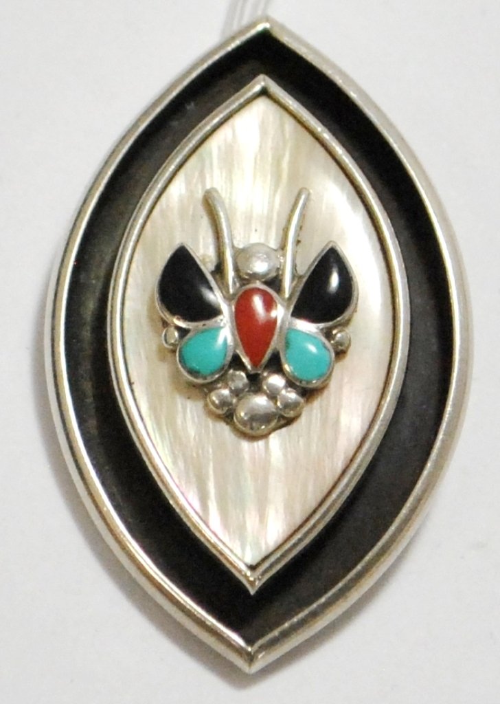 Old Pawn Multi-Stone Butterfly Pendant - Ivan J Ts: Old Pawn Multi-Stone Butterfly Pendant - Ivan J Tsethlikai SKU: pp0592 Measures 2" tall by 1-1/4" wide. Stones present: Coral, Turquoise, Onyx, Mother of Pearl. 